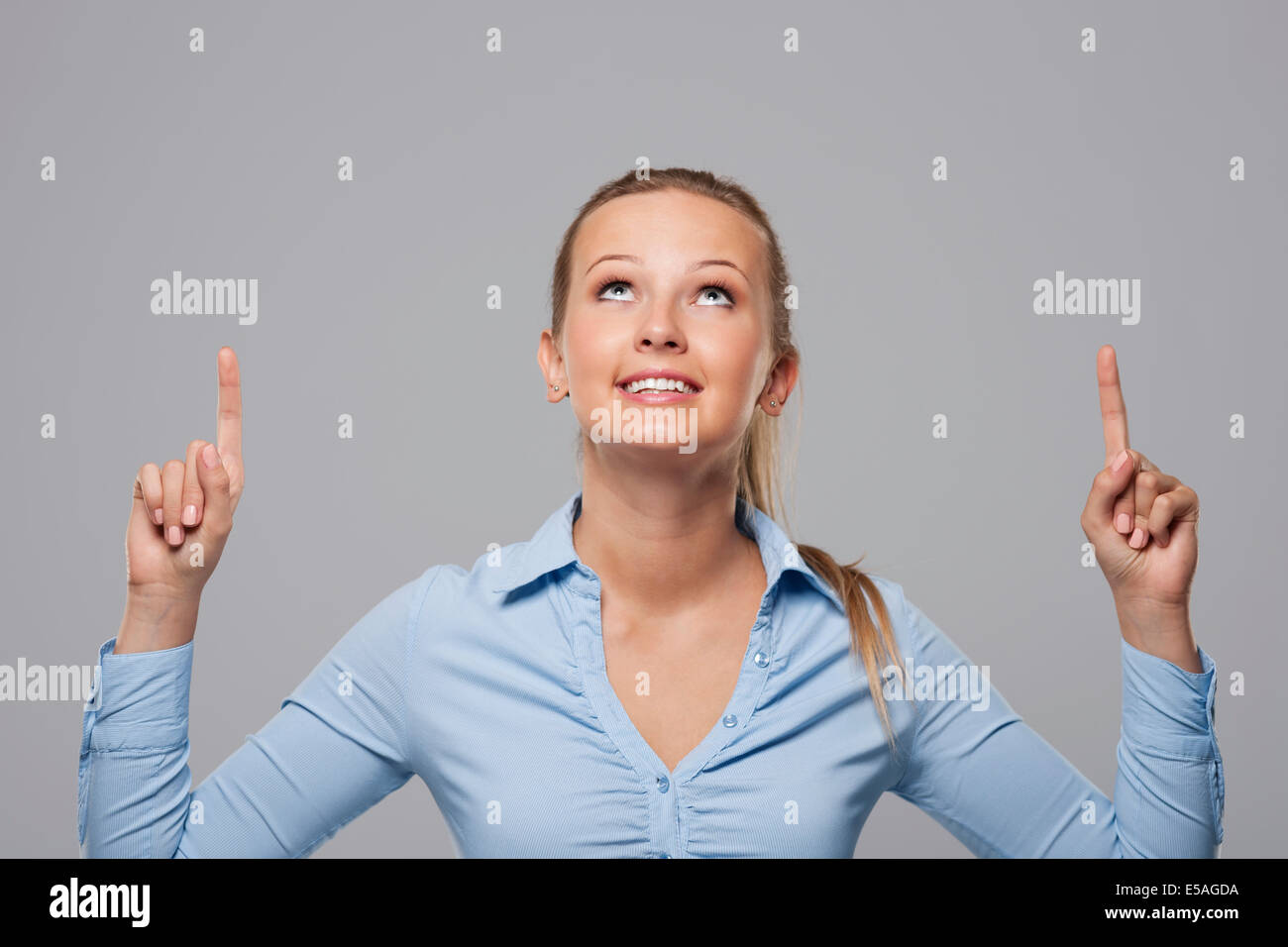 Woman peeking out pointing hi-res stock photography and images - Alamy