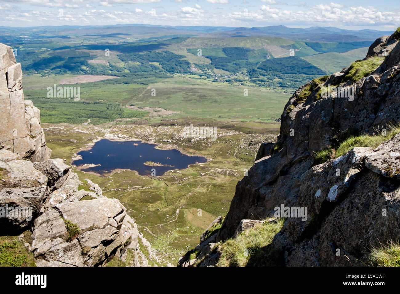 High view down a gully on Carnedd Moel Siabod ridge to Llyn y Foel in Cwm Foel in mountains of Snowdonia National Park Conwy North Wales UK Britain Stock Photo
