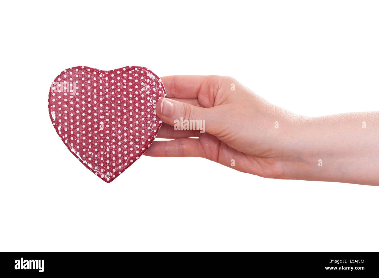 Red heart is holding from a female hand Stock Photo - Alamy