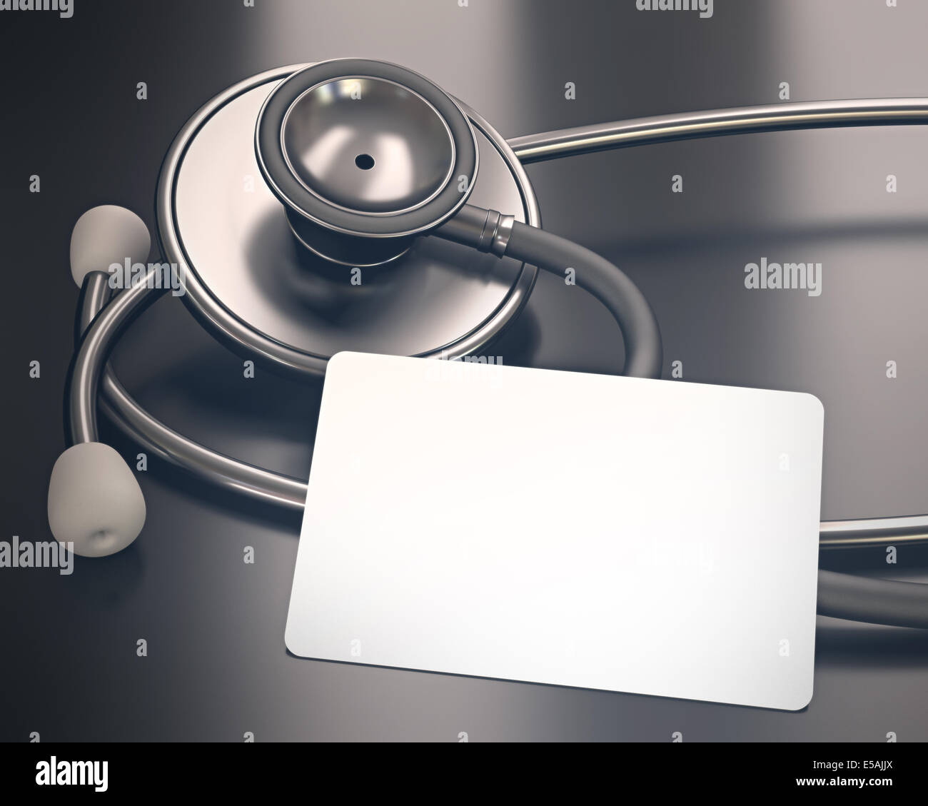 Stethoscope and blank card on the table. Your medical information on the card. Clipping path on the card. Stock Photo