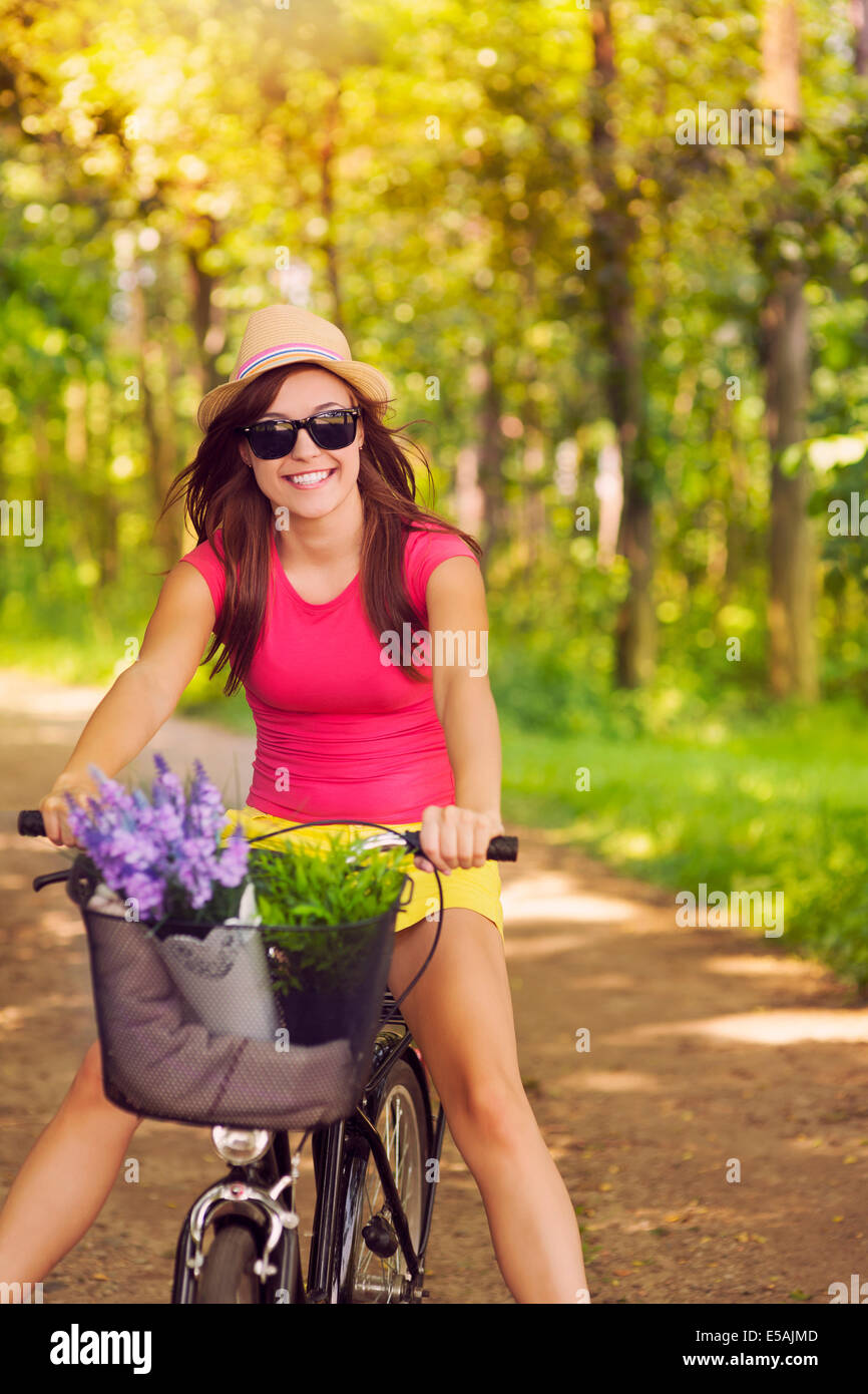 Beautiful woman have fun during cycling, Debica, Poland. Stock Photo