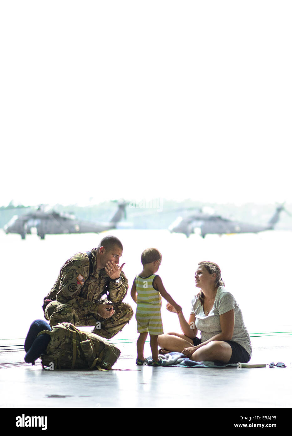 July 24, 2014 - Fort Bragg, NC, USA - July 24, 2014 - Fort Bragg, N.C., USA - Warrant Officer Casey Matullo spends sometime with his wife, Kristen, and his son, Gabriel, 2, Thursday, July 24, 2014, on Fort Bragg, N.C., before he and his fellow soldiers from Company C, 3rd General Support Aviation Battalion, 82nd Combat Aviation Brigade, deploy to Afghanistan for nine months. (Credit Image: © Andrew Craft/ZUMA Wire/ZUMAPRESS.com) Stock Photo