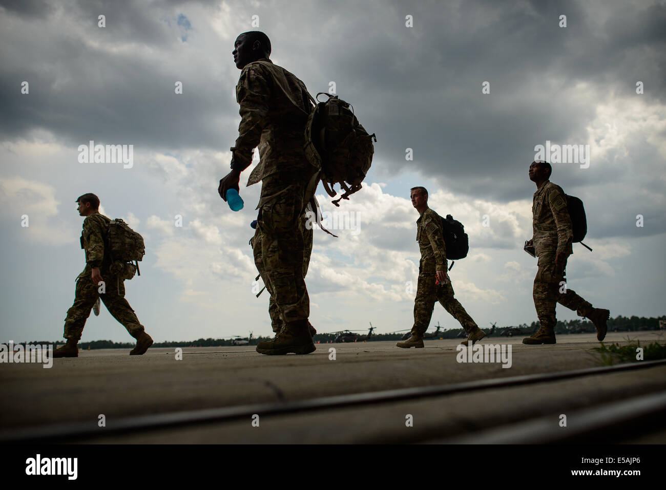 July 24, 2014 - Fort Bragg, NC, USA - July 24, 2014 - Fort Bragg, N.C., USA - Soldiers with Company C, 3rd General Support Aviation Battalion, 82nd Combat Aviation Brigade walk to their buses Thursday, July 24, 2014, on Fort Bragg, N.C., for a nine month deployment to Afghanistan. (Credit Image: © Andrew Craft/ZUMA Wire/ZUMAPRESS.com) Stock Photo