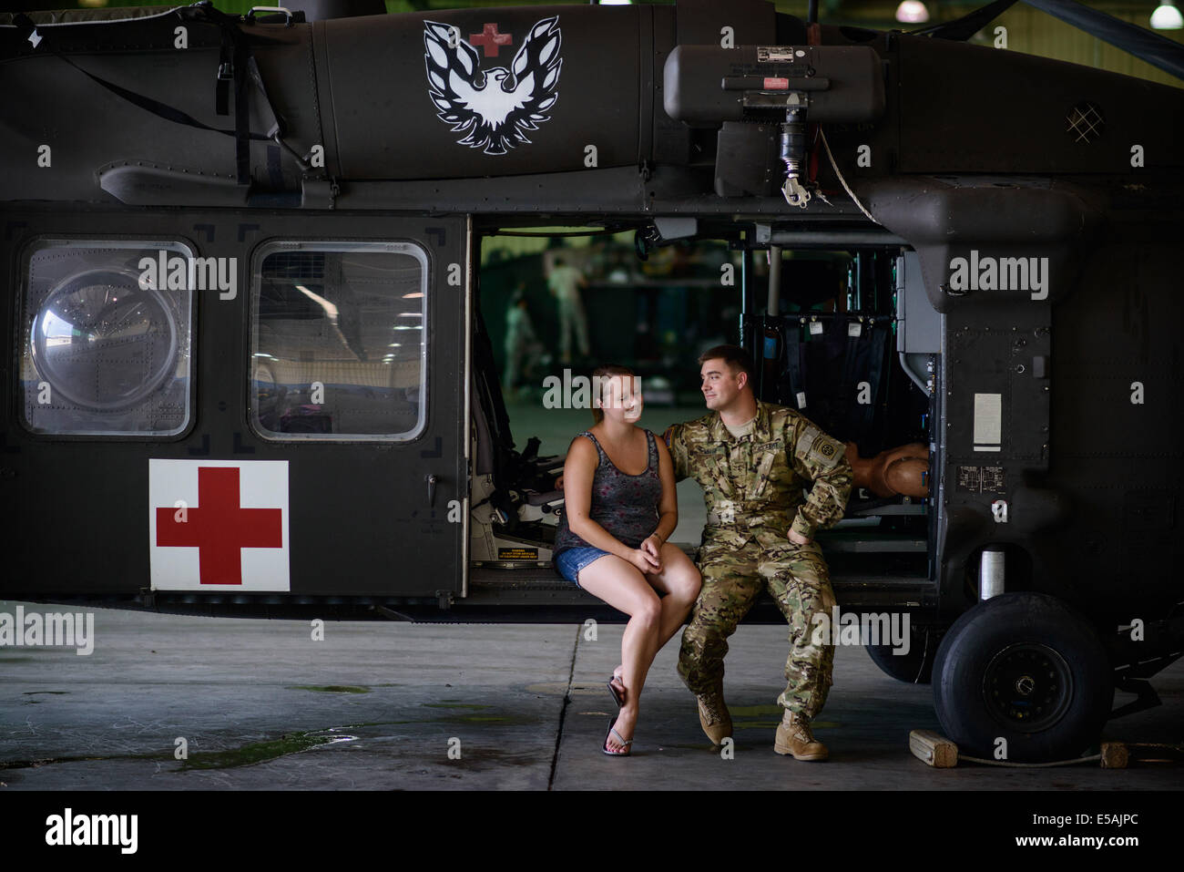 July 24, 2014 - Fort Bragg, NC, USA - July 24, 2014 - Fort Bragg, N.C., USA - Chief Warrant Officer Danny Miller spends some quiet time with his wife, Patti, Thursday, July 24, 2014, on Fort Bragg, N.C., before he and his fellow soldiers from Company C, 3rd General Support Aviation Battalion, 82nd Combat Aviation Brigade, deploy to Afghanistan for nine months. (Credit Image: © Andrew Craft/ZUMA Wire/ZUMAPRESS.com) Stock Photo