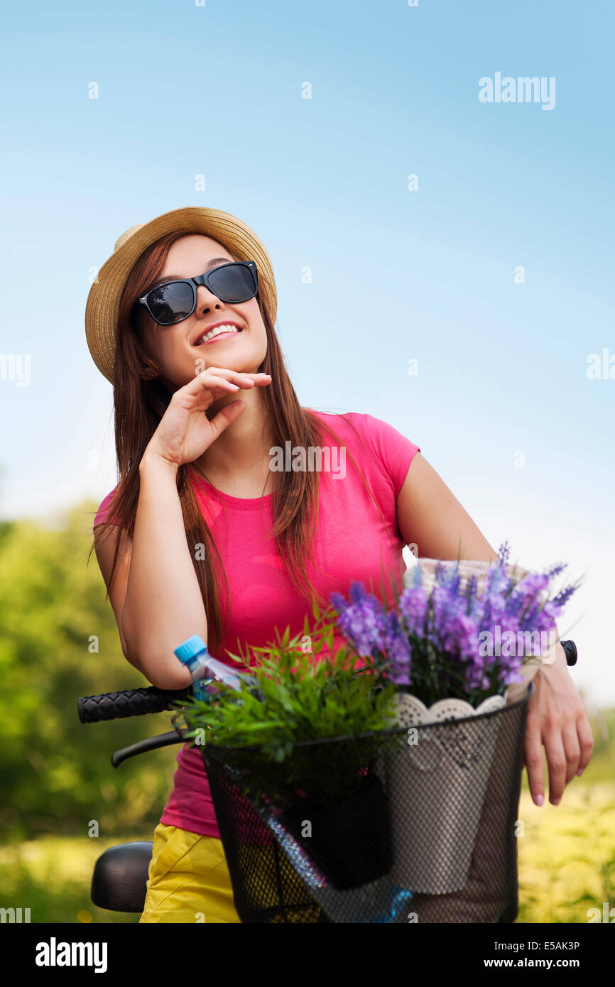 Portrait of beautiful young woman with bike, Debica, Poland. Stock Photo