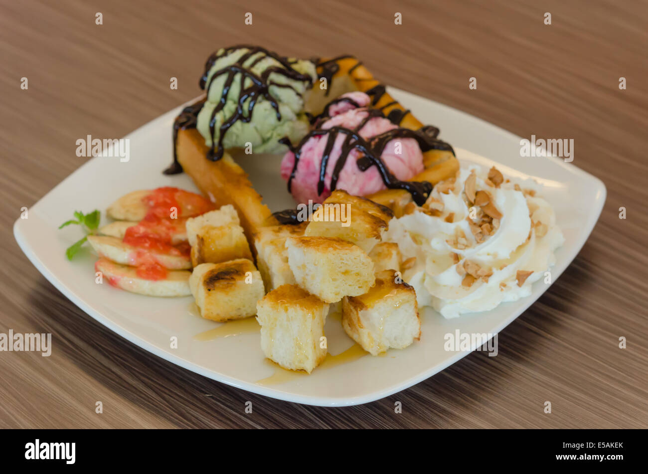 Honey toast and whipping cream with chocolate  sauce and ice cream Stock Photo
