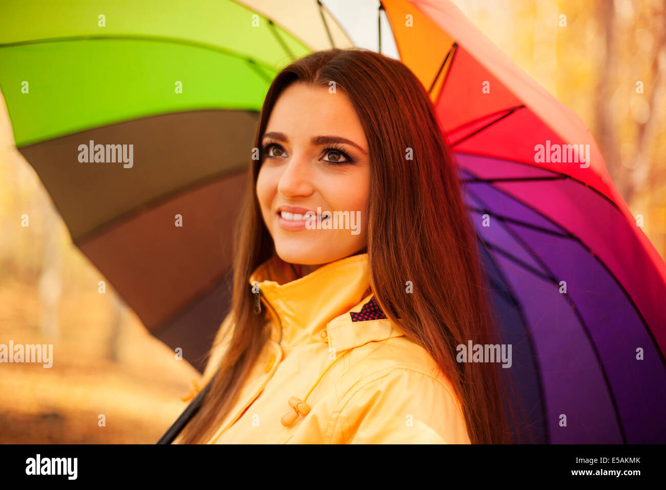 Smiling woman standing under the umbrella, Debica, Poland Stock Photo