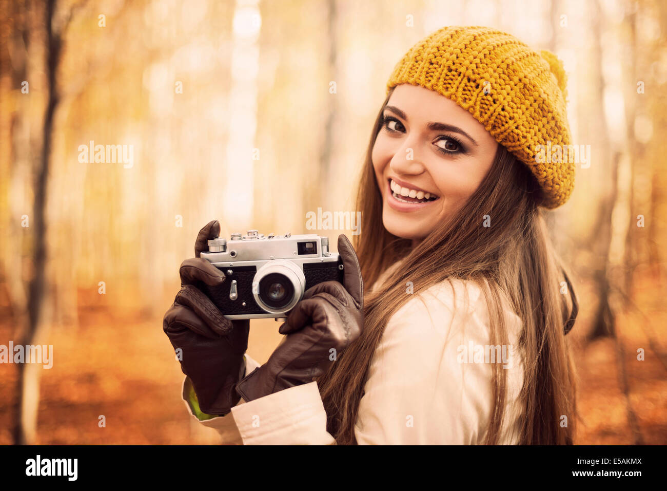Smiling young woman holding retro camera, Debica, Poland Stock Photo - Alamy