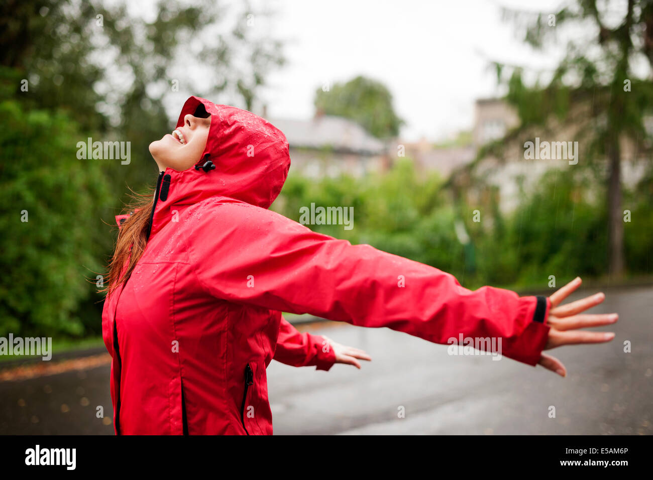 Female enjoying rain, Debica, Poland Stock Photo