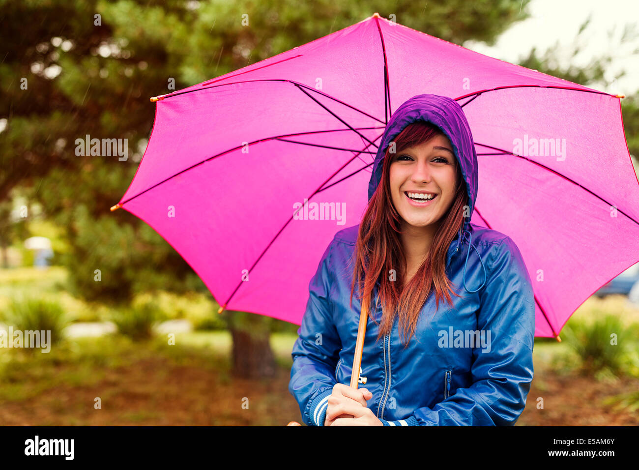 Portrait of happy woman with umbrella, Debica, Poland Stock Photo