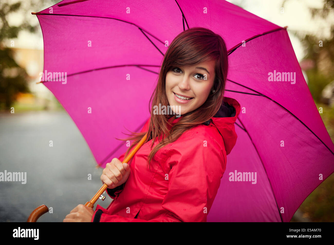 Portrait of young woman with umbrella, Debica, Poland Stock Photo