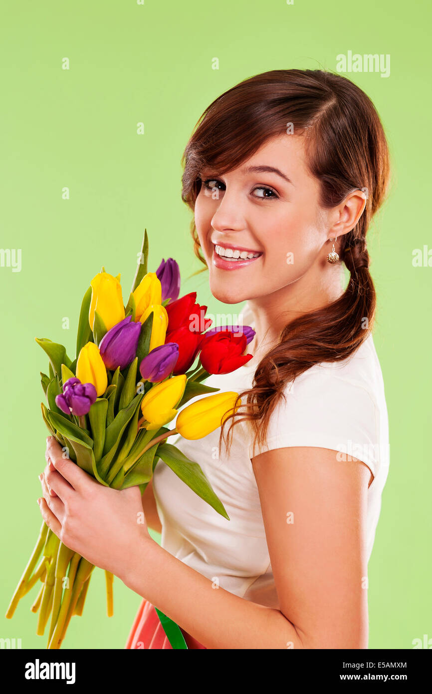 Portrait of a young woman with spring flowers Debica, Poland Stock Photo