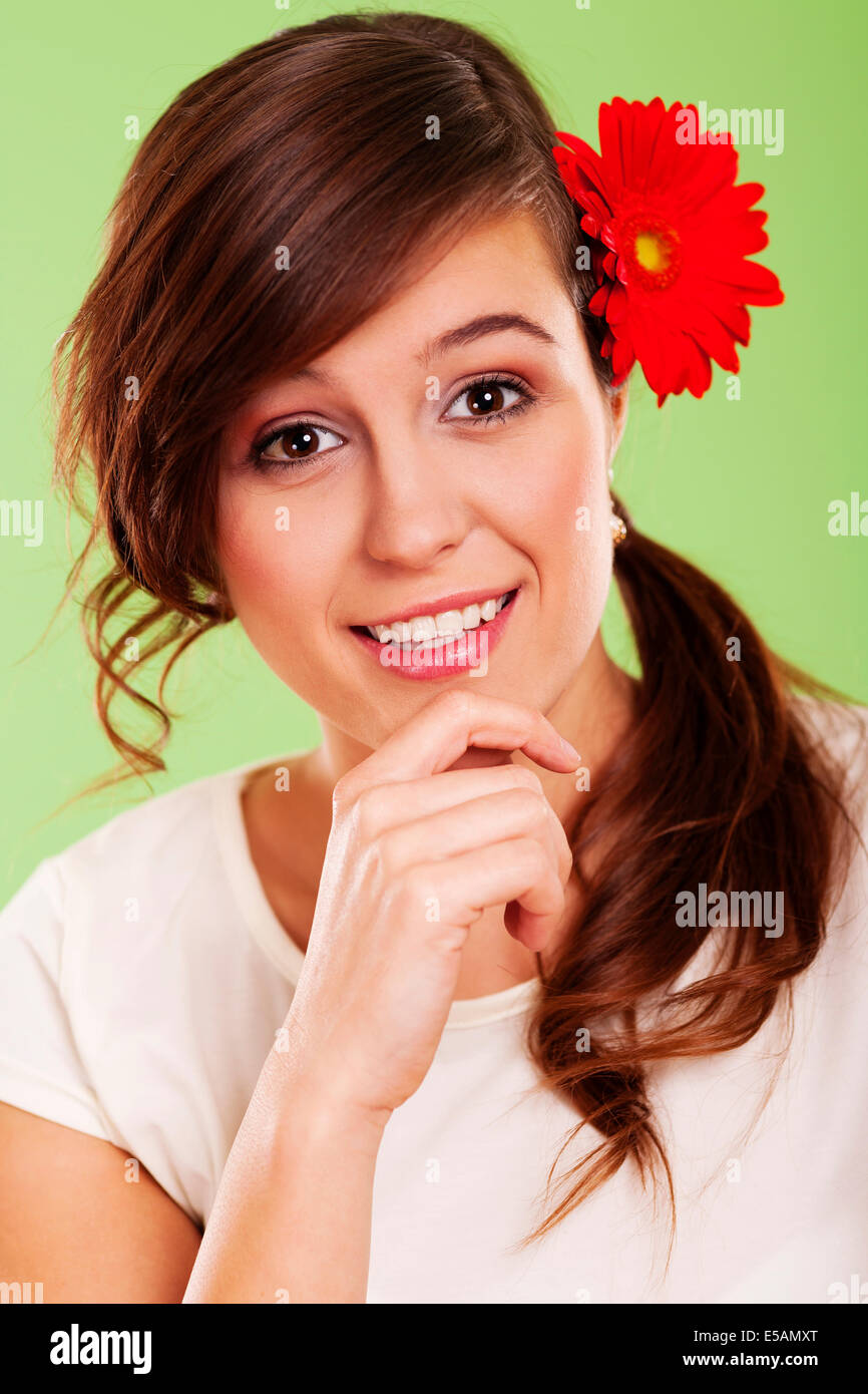 Smiling woman with flower in her hair, Debica, Poland Stock Photo
