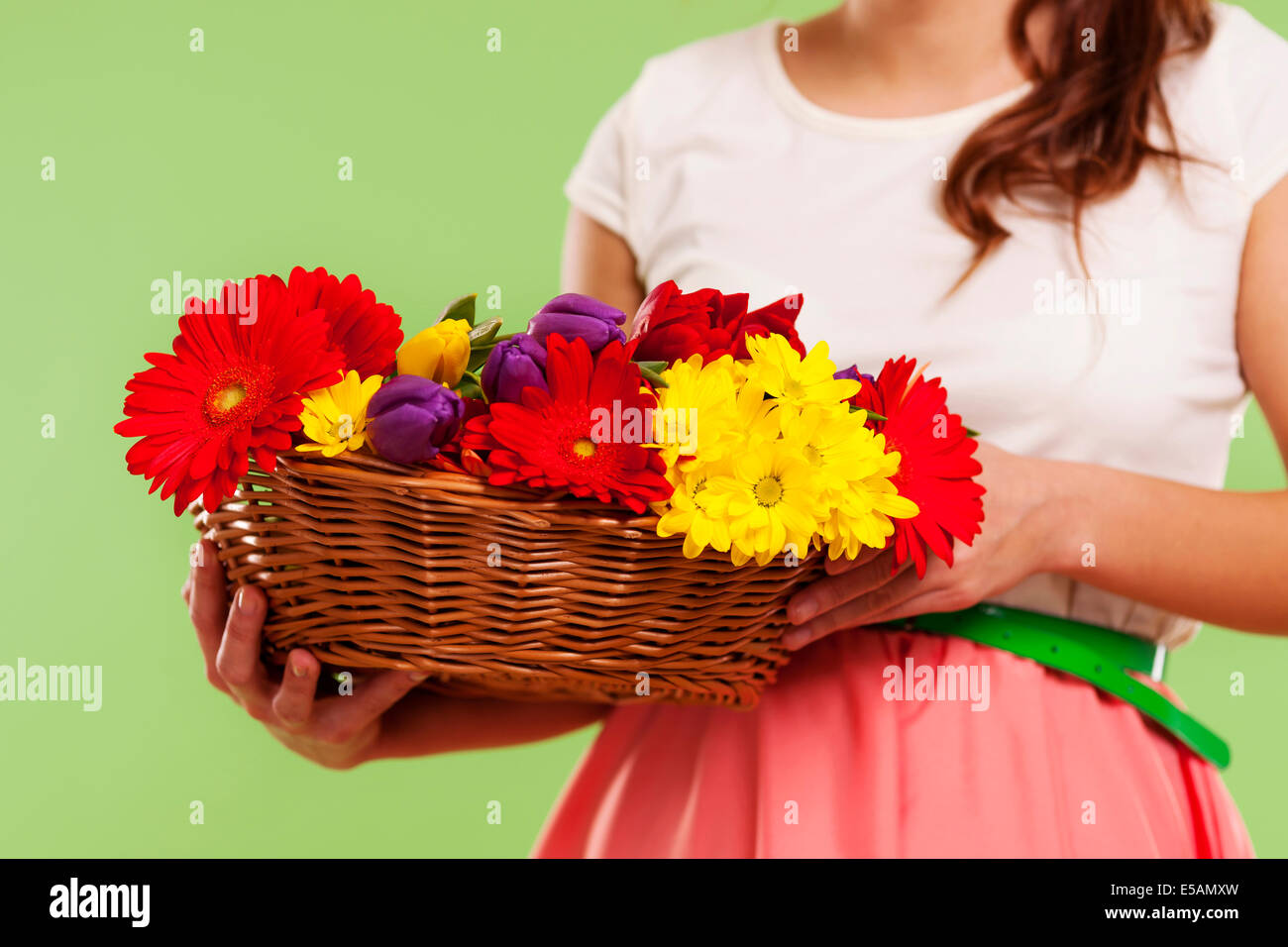 Spring flowers in a basket, Debica, Poland Stock Photo