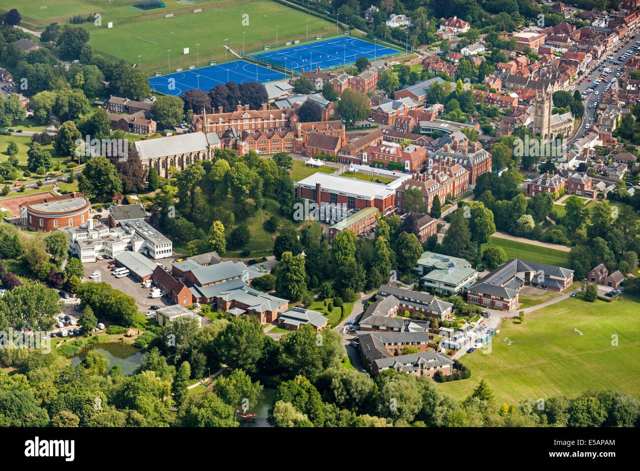 Aerial view of Marlborough College Marlborough, Wiltshire, UK, with ancient mound c2400 BC to left of centre. JMH6210 Stock Photo
