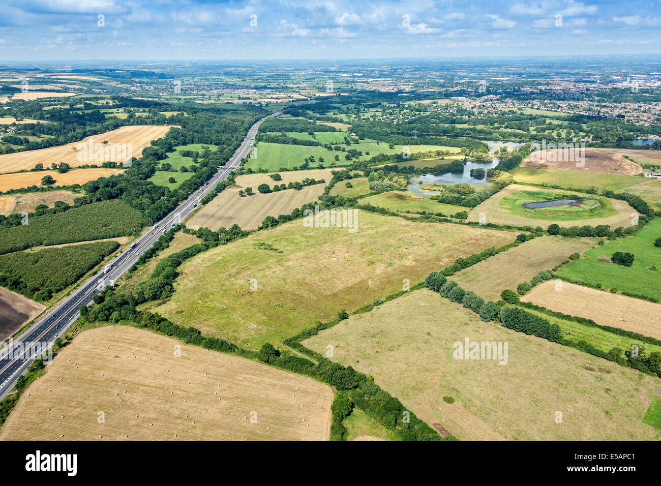Aerial view of Coate Water Country Park and M4 Motorway left looking towards Swindon Wiltshire, UK. JMH6221 Stock Photo