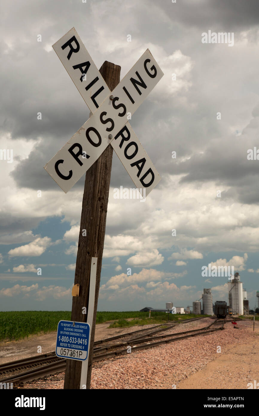 Venango, Nebraska - A railroad crossing near grain elevators in the wheat growing area of western Nebraska. Stock Photo