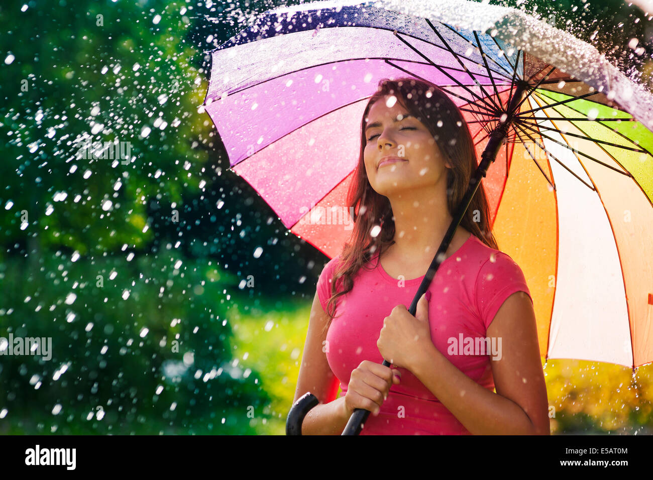 Young woman breathing fresh air during the spring rain  Debica, Poland Stock Photo