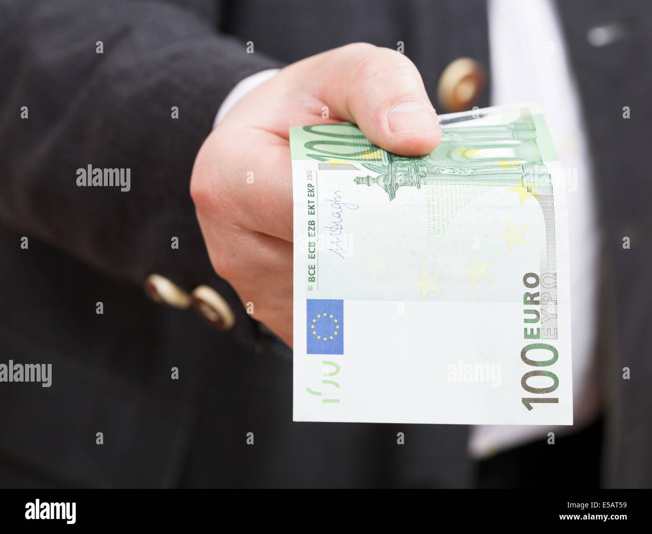 front view of hundred euro banknote in hand close up Stock Photo - Alamy