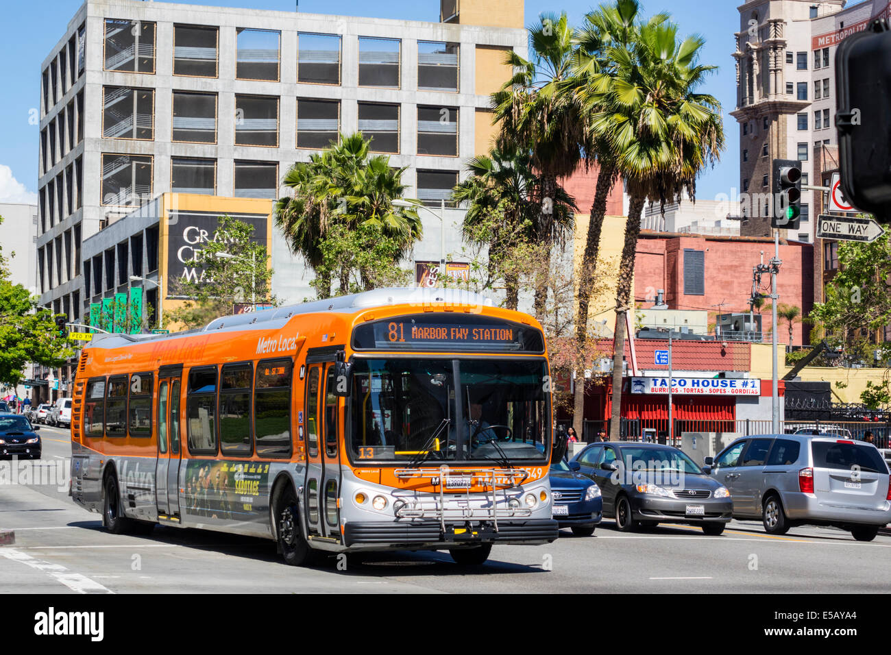 Los Angeles California,Downtown,South Hill Street,street scene,traffic,LACMTA,Metro bus,coach,MTA,mass transit,bus,coach,highway Route,orange,CA140401 Stock Photo