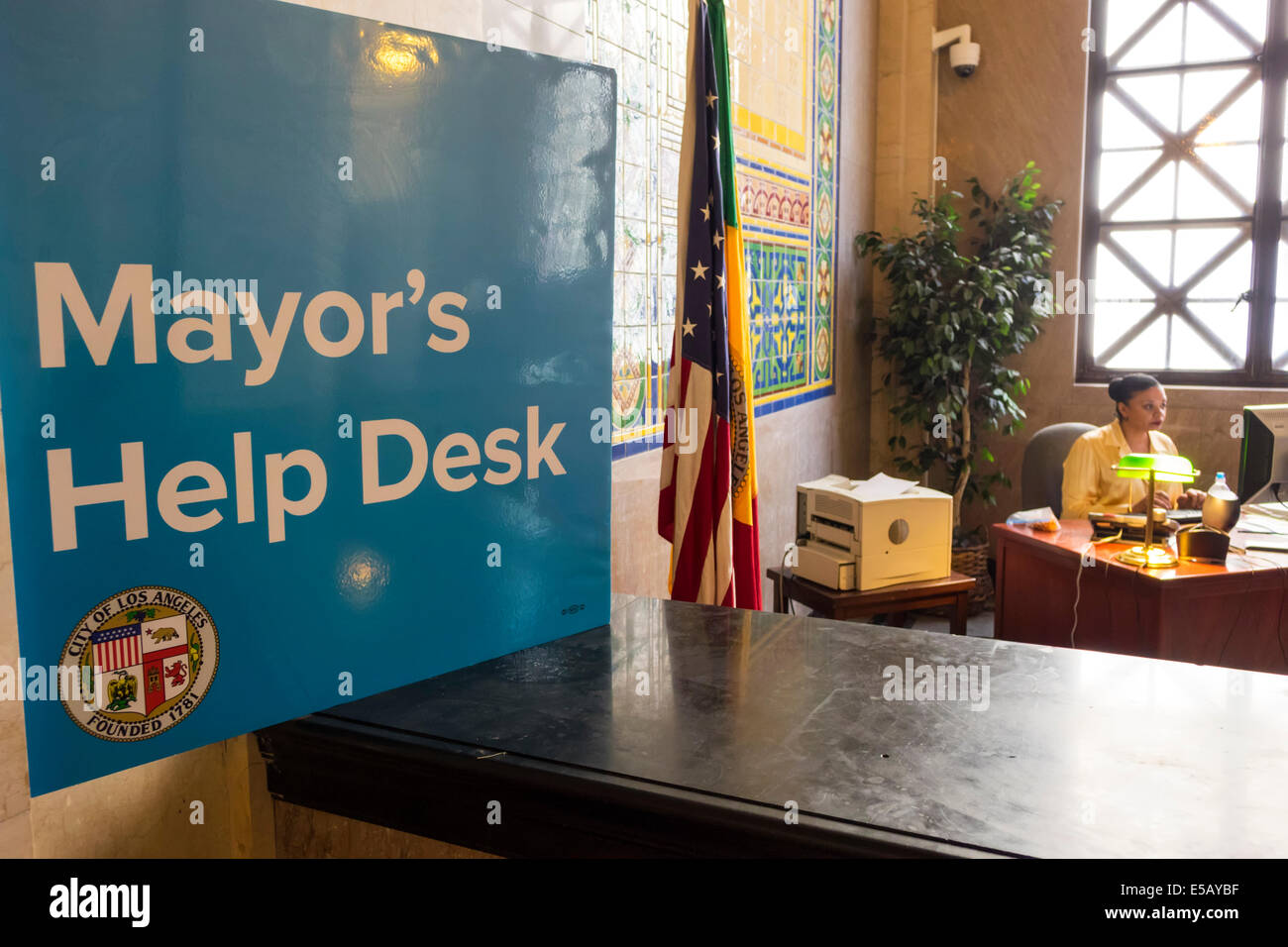 Los Angeles California,Downtown,Civic Center district,Los Angeles City Hall,1928,interior inside,Mayor's office,Mayor's Help Desk,sign,flag,Black woma Stock Photo