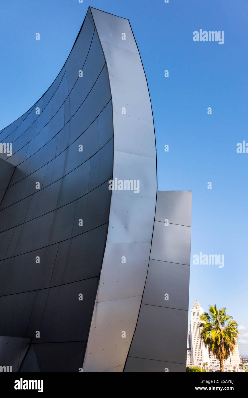 Los Angeles California,Downtown,Walt Disney Concert Hall performance venue,exterior,architecture Frank Gehry,curve,stainless steel,wall,palm tree,pers Stock Photo