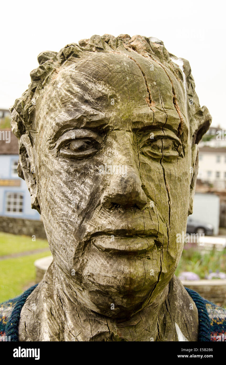 Wooden sculpture of Welsh literary figure Dylan Thomas in his home town of Laugharne, Carmarthenshire Stock Photo