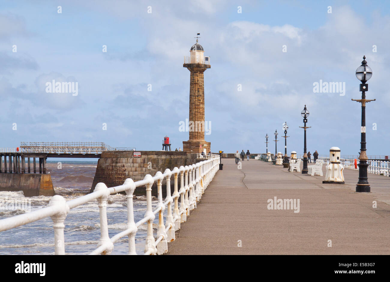 View of the sea at Whitby showing the pier and lighthouse Stock Photo