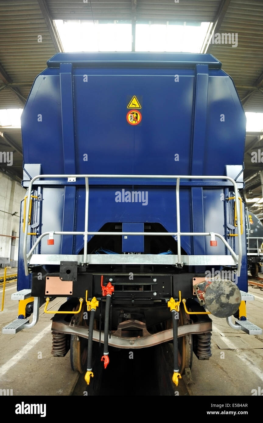 Industry detail with a freight wagon on the factory production line Stock Photo