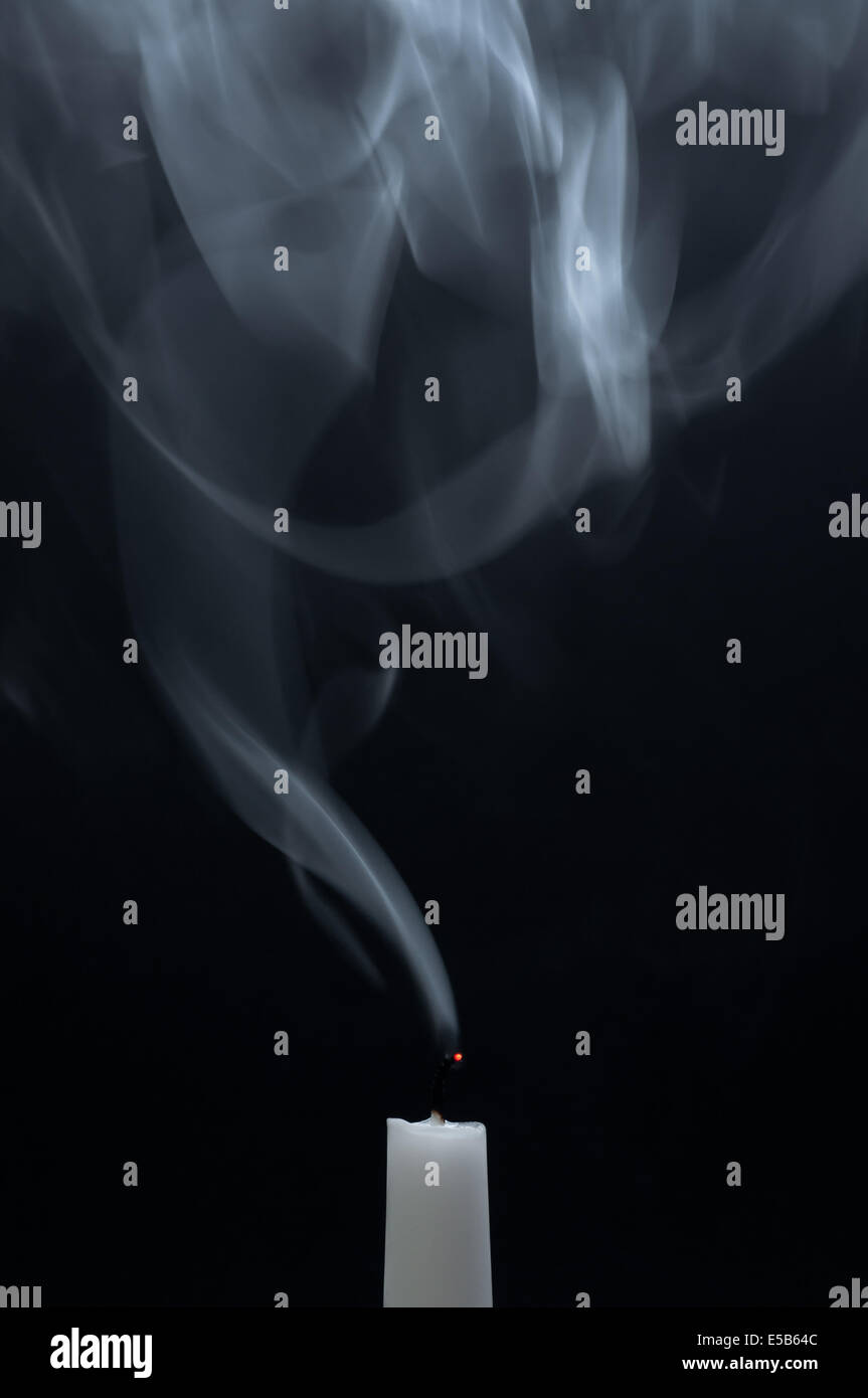 A white candle is smoking after it is extinguished Stock Photo Alamy