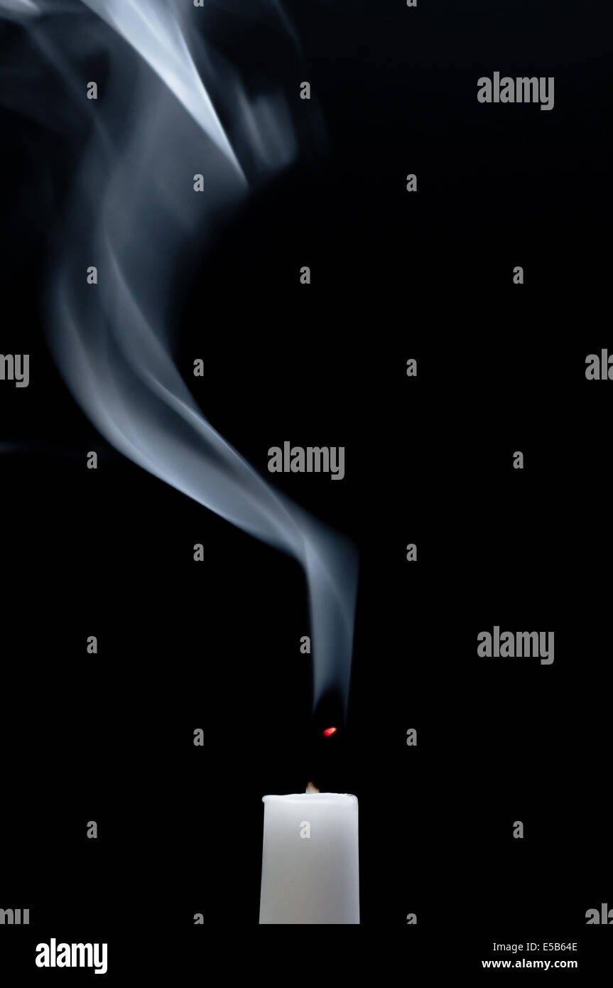A white candle is smoking after it is extinguished Stock Photo Alamy