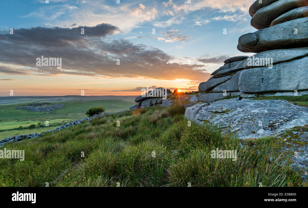Beautiful sunset over a granite tor at the Cheesewring on Stowes Hill near the Minions on Bodmin Moor in Cornwall Stock Photo