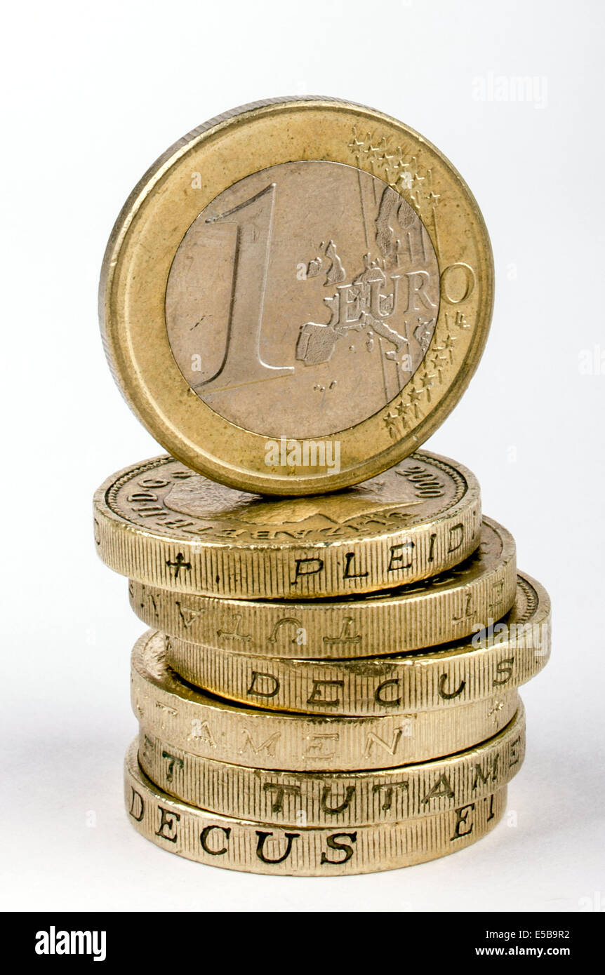 A stack of British Pound Coins with a 1 Euro Coin on top Stock Photo - Alamy