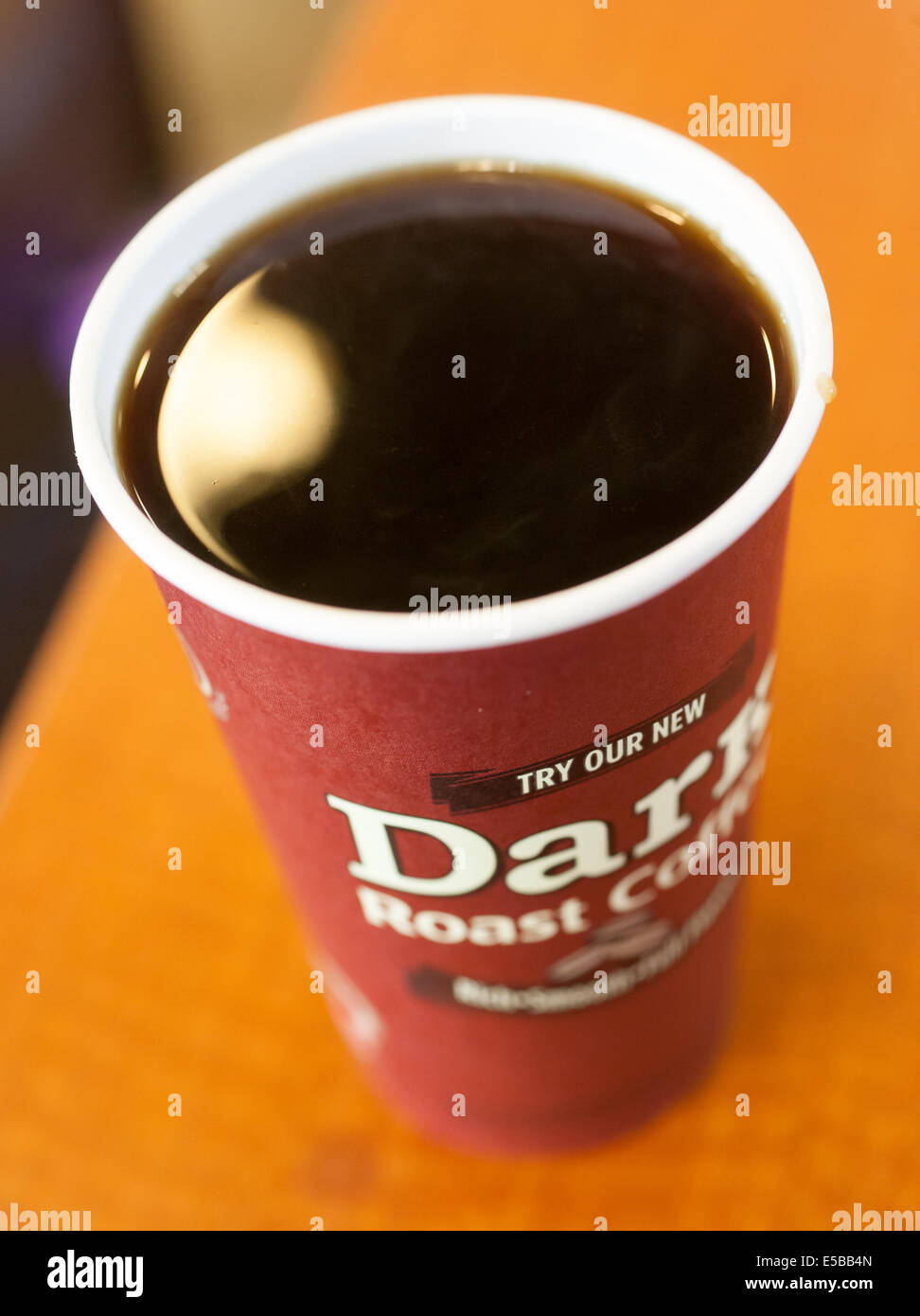 A fresh cup of hot coffee from Tim Horton's sitting on a table. Stock Photo
