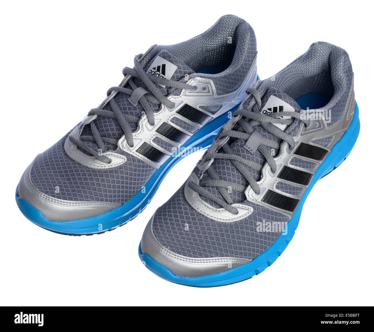 Silver and blue Adidas running shoes isolated on white background Stock Photo