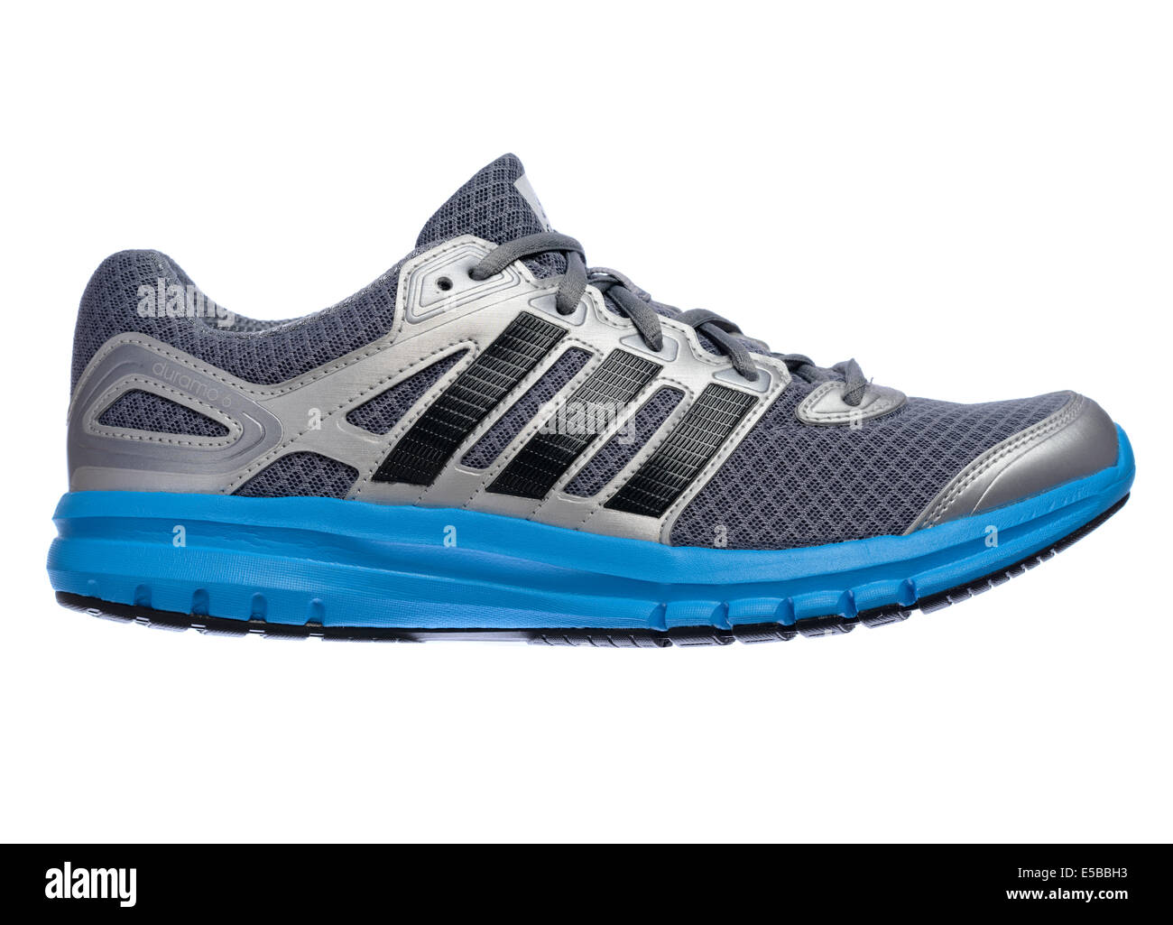 Lateral view of a silver and blue Adidas running shoe cut out isolated on  white background Stock Photo - Alamy