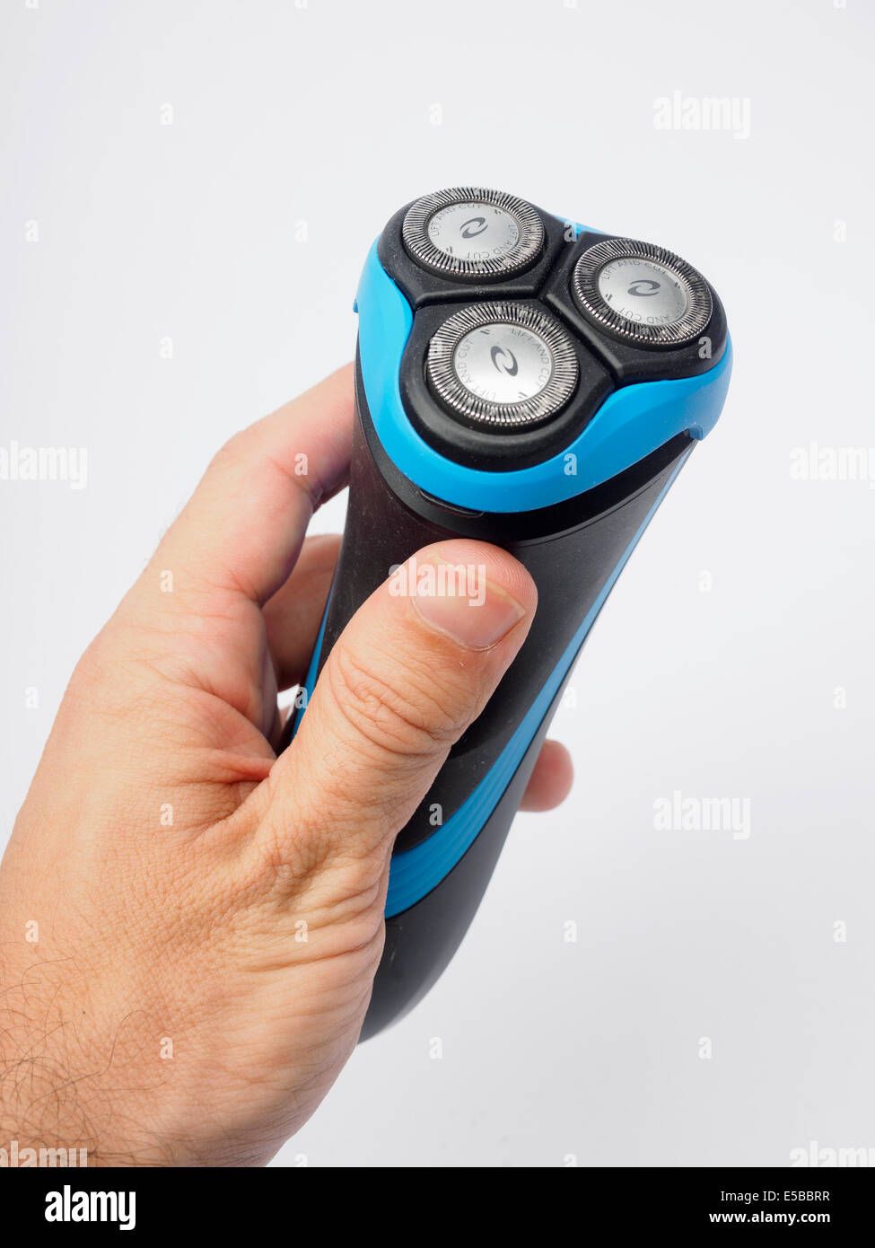 Man holding an electric shaver Stock Photo