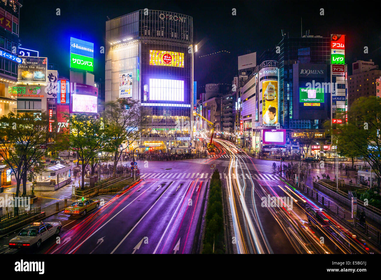 TOKYO, JAPAN - MARCH 30, 2014: Shibuya Ward at Shibuya crossing is one of Tokyo's major nightlife and fashion centers. Stock Photo