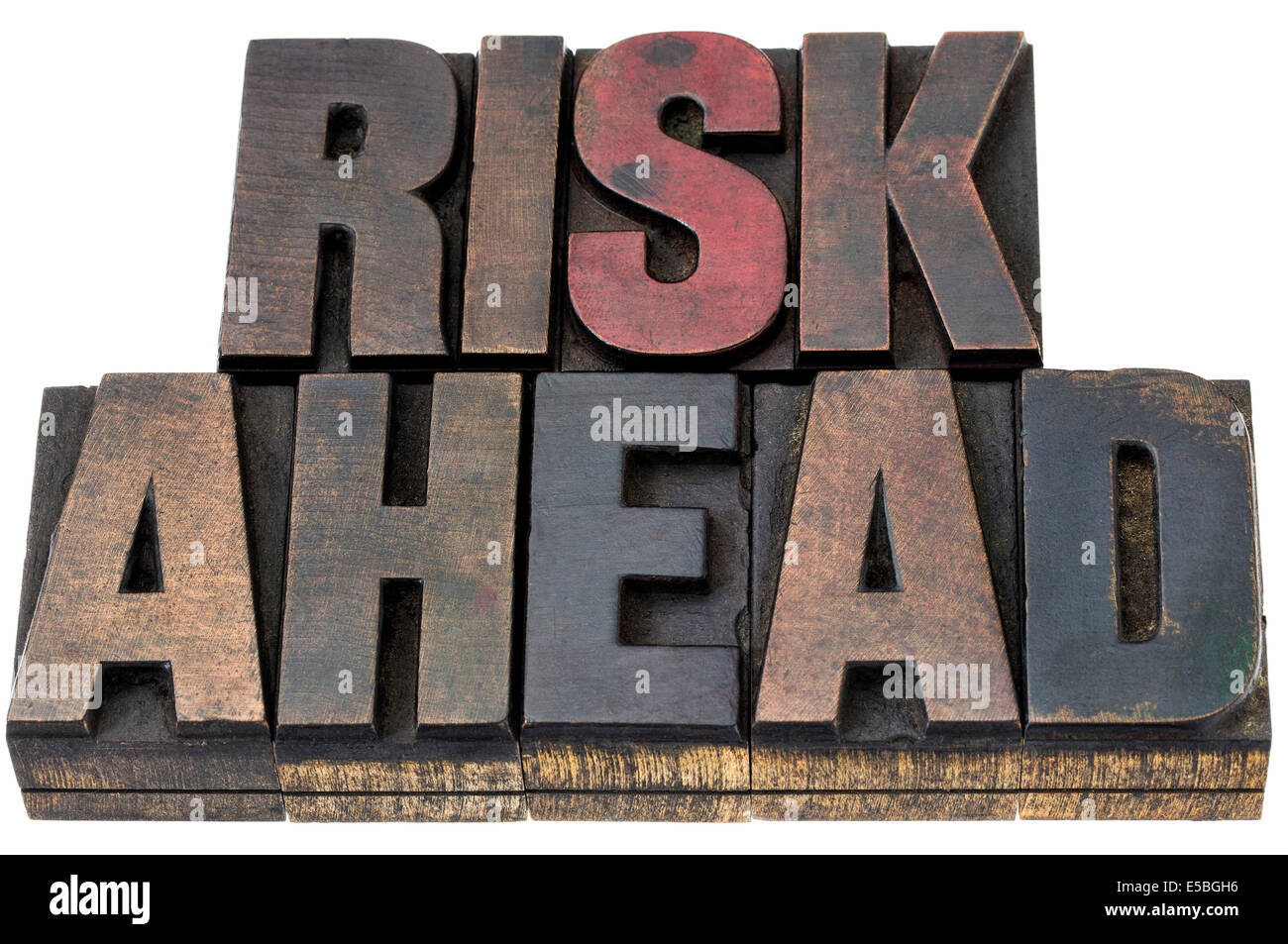 risk ahead - isolated words in vintage letterpress wood type with ink patina Stock Photo