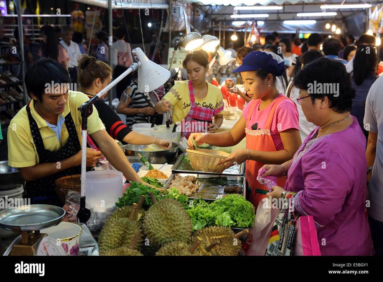 Vegetables and fruits stall at a night market in Bangkok, Thailand Stock Photo