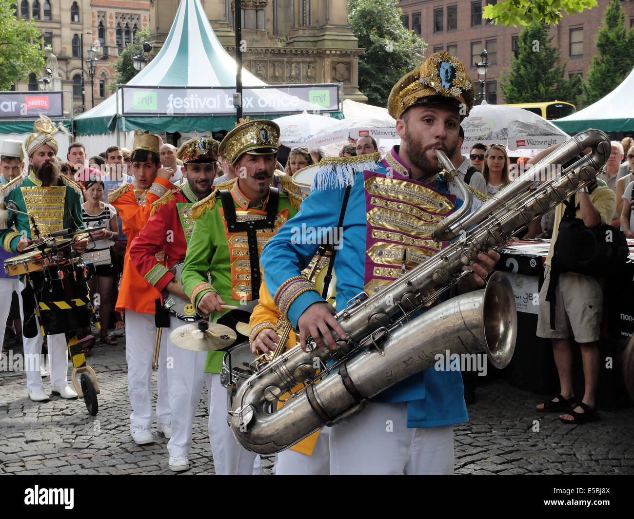Manchester, UK. 26th July, 2014. 'Mr Wilson's second liners' New Orleans style marching band get the public on its feet at the Manchester Jazz Festival in Albert Square, Manchester UK CREDIT:RowlandJones/Alamy Live News Stock Photo