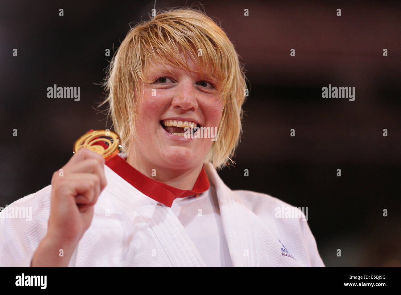 SECC, Glasgow, Scotland, UK, Saturday, 26th July, 2014. Scotland's Sarah Adlington celebrates winning Gold in the Women's +78kg Judo Final at the Glasgow 2014 Commonwealth Games Stock Photo