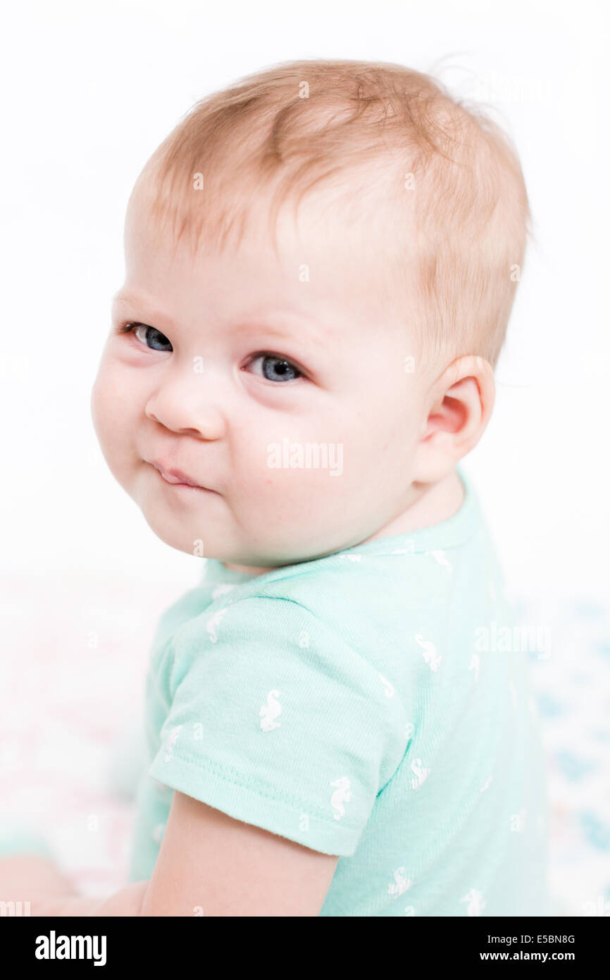 Cute baby girl playing with her toys on a blanket Stock Photo - Alamy