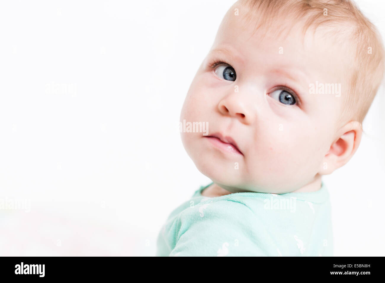 Cute baby girl playing with her toys on a blanket Stock Photo - Alamy