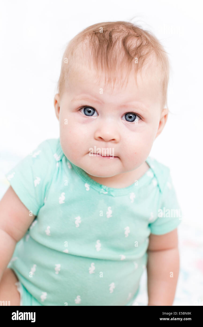 Cute baby girl playing with her toys on a blanket Stock Photo - Alamy