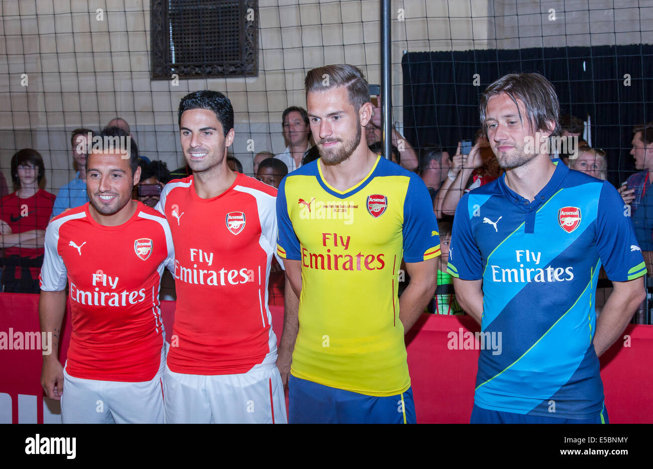 New York, NY, USA - July 25, 2014: (L-R) Footballers Santi Cazorla, Mikel  Arteta, and Tomas Rosicky greet fans at the PUMA partners with Arsenal  Football Club to Debut Monumental Cannon event