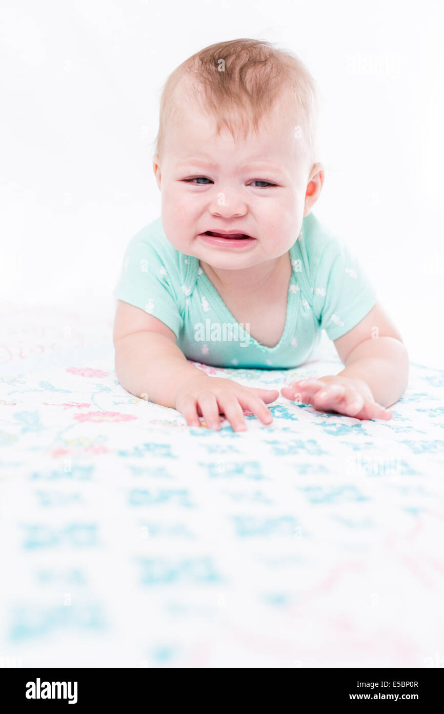 Cute baby girl playing with her toys on a blanket Stock Photo - Alamy