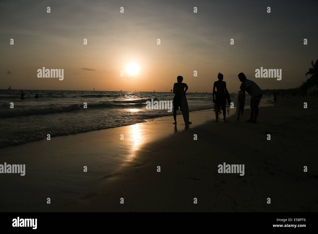 Boracay sunset with silhouette of skim boarders in Boracay, Aklan Philippines Stock Photo