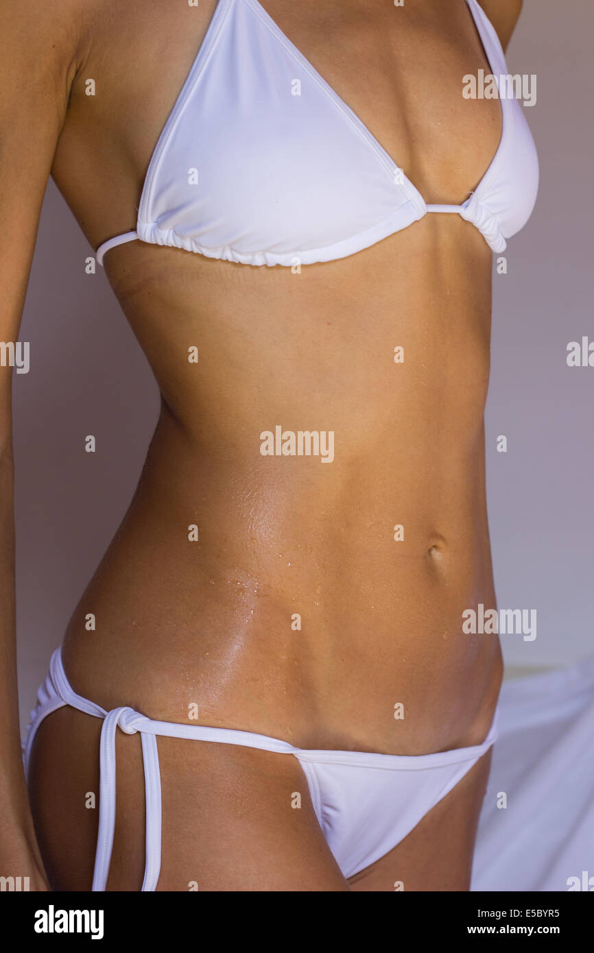 woman female body slim diet perfect torso lingerie bikini 'white bikini' tan tanned suntan Stock Photo