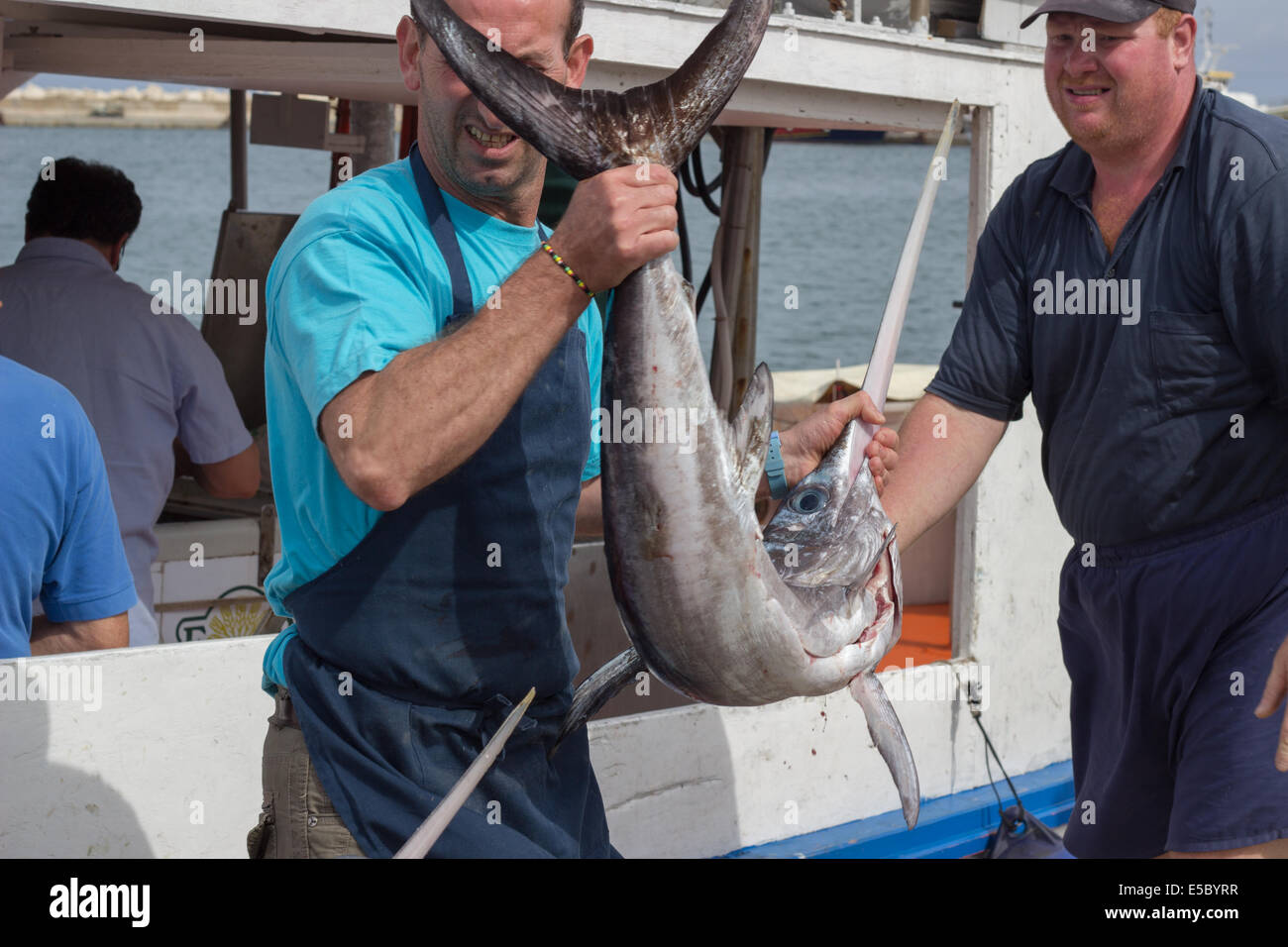 fishing" men fishermen swordfish holding vessel boat Stock